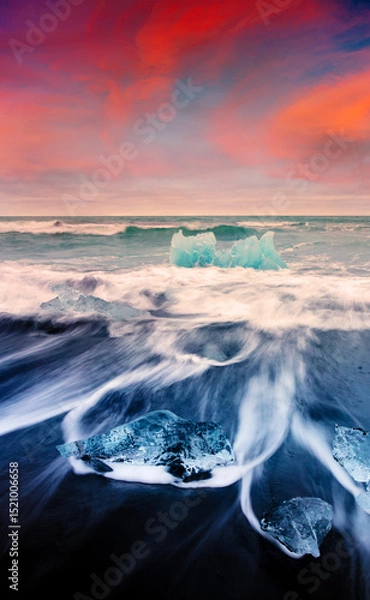 Obraz Blocks of ice washed by the waves on Jokulsarlon beach
