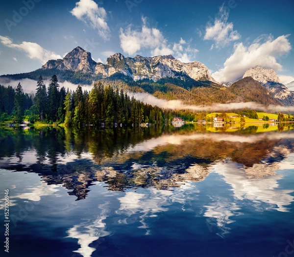 Obraz Reflexion of blue sky in the pure water of Hintersee lake.
