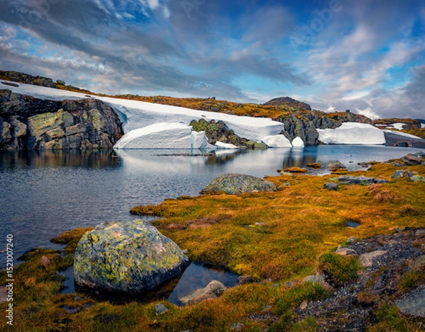 Obraz Picturesque summer view of melting snow on the side of the Aurlandsvegen - Mountain road (Bjorgavegen), Aurland in Sogn og Fjordane county, Norway.