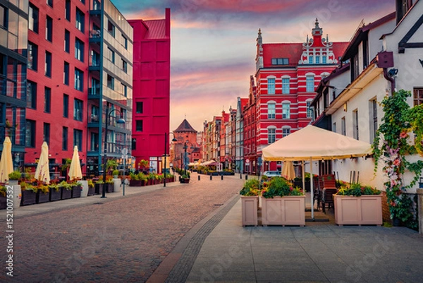 Obraz Red modern and old buildings on the empty street of Gdansk. Colorful morning cityscape of Gdansk. Fantastic summer sunrise in old port on Baltic sea, Poland, Europe. Traveling concept background..