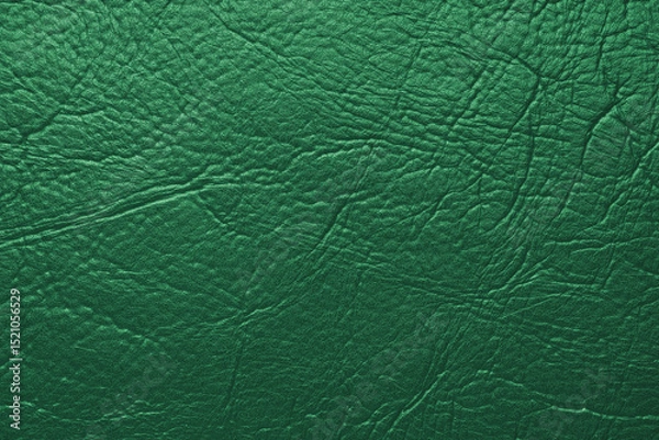 Fototapeta Close up, macro texture of green glossy natural genuine leather, leatherette structure, artifical skin surface with embossed pattern. Background, wallpaper, backdrop