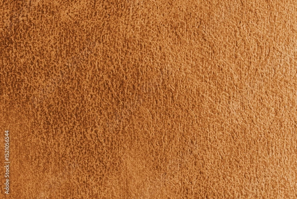 Fototapeta Close up, macro structure of orange suede fabric with abstract embossed shabby, messy texture. Upholstery, decorative cloth structure, canvas for home decor. Background, backdrop, wallpaper.