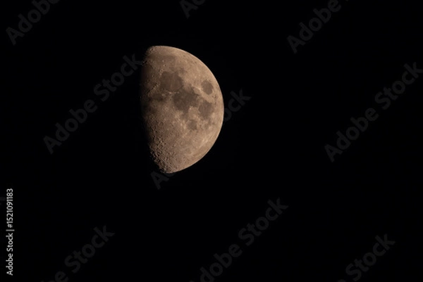 Fototapeta Detailed view of the waxing gibbous Moon against a black night sky. Surface craters and texture are clearly visible in this high-resolution astronomical photo.