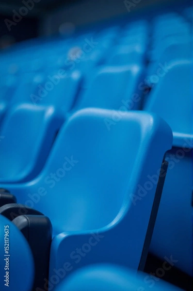 Obraz Rows of blue seats in a stadium, suitable for sports or concert events