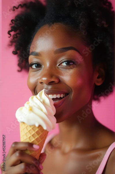 Obraz A woman enjoying a cold treat on a hot day or a sweet snack any time of the year