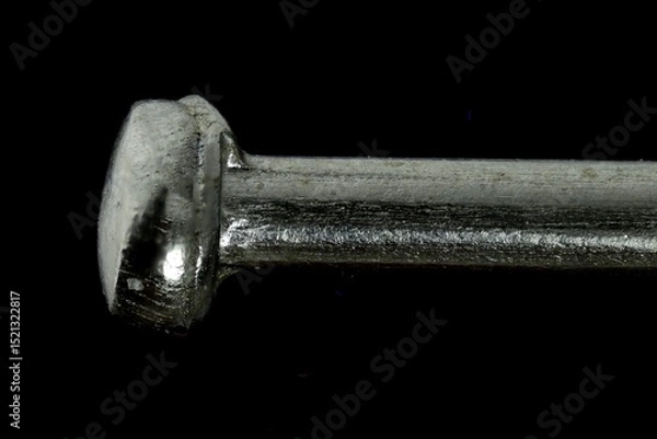 Fototapeta Macro View of a Pinhead with Textured Metallic Surface