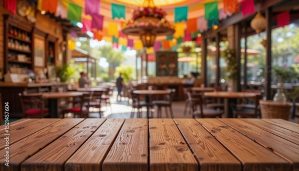 Fototapeta Empty Rustic Wooden Table in Cozy Outdoor Café Setting