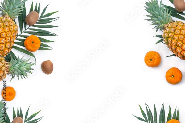 Obraz Tropical fruits, pineapple, tangerine, kiwi and palm leaves on a white background with copy space for text. Top view, flat lay