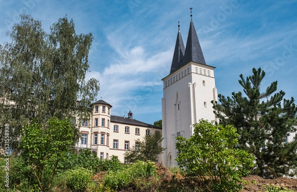 Fototapeta View of the former Johannisberg Monastery in the Rheingau under a white-blue sky
