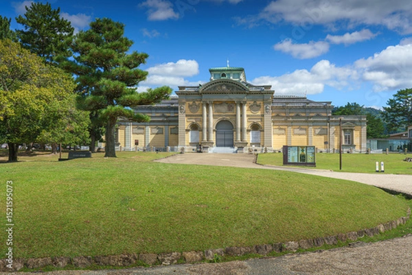 Fototapeta Nara, Japan - Sep 26 2024, panoramic view of the garden in front of the National Museum of Nara, with museum building on background, at daytime with blue sky, without people, Nara, Japan
