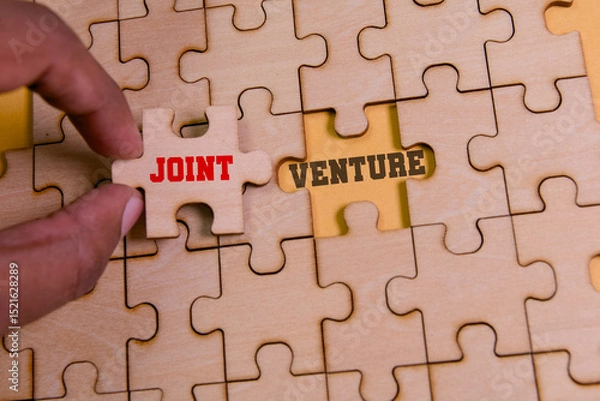 Obraz Building partnerships with a joint venture puzzle piece