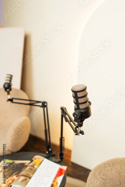 Fototapeta Podcast studio setting with microphone and chairs for engaging discussions and lectures
