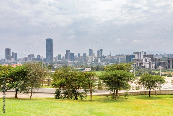 Fototapeta Modern skyscrapers of developing downtown district of Addis Ababa and green park in the foreground, Ethiopia