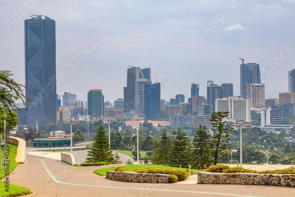 Fototapeta Central business district with modern skyscrapers of downtown of Addis Ababa road and green park in the foreground, Ethiopia