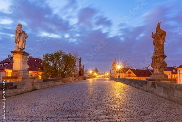 Fototapeta Charles Bridge with towers and sculptures at dawn in Prague, Czech Republic