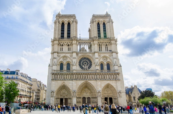 Obraz Notre-Dame Roman Catholic Cathedral front facade in Paris, a wonderful gothic churchwith a lot of people visiting it