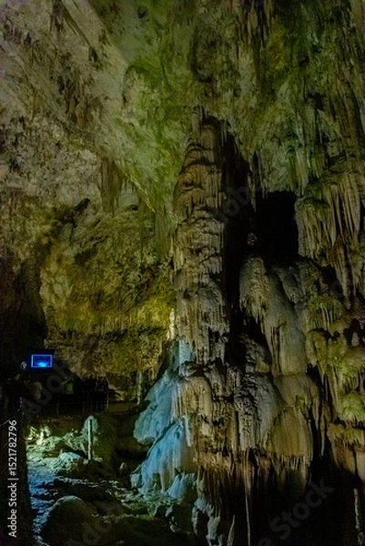 Obraz Exploring beautiful Postojna cave in Slovenia the most visited european cave.  Thousands of stalagmites and stalactites