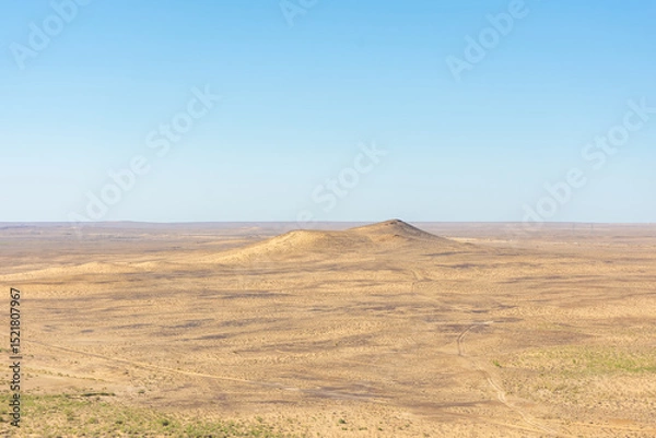 Obraz Kyzylkum (red sand) Desert of the Khorezm region from Chilpik Kala,  Uzbekistan