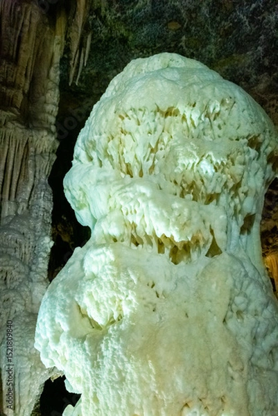 Obraz Exploring beautiful Postojna cave in Slovenia the most visited european cave.  Thousands of stalagmites and stalactites