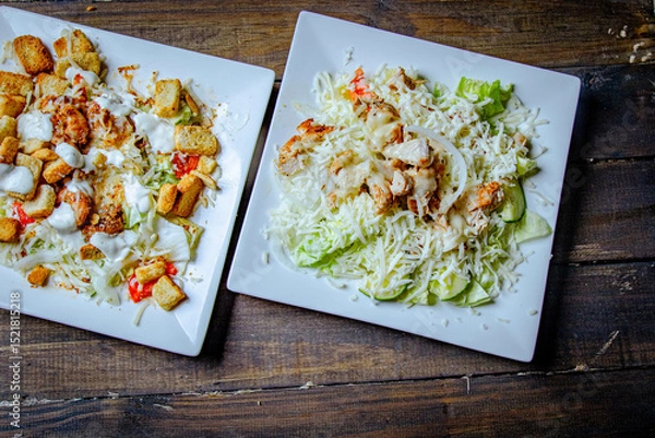 Fototapeta salad plate with lettuce and bread top view 