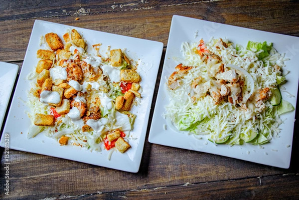 Fototapeta salad plate with lettuce and bread top view 