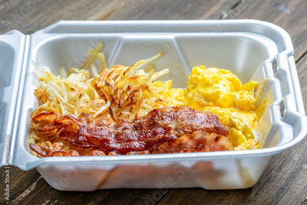 Fototapeta breakfast box with egg and bacon served breakfast with has brown.