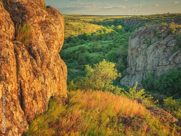 Obraz panoramic view in canyon with granite walls in sunset light