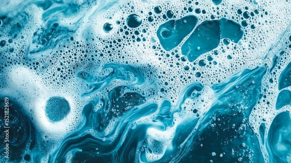 Obraz A close up view of blue liquid with white foam and bubbles creating an abstract pattern design