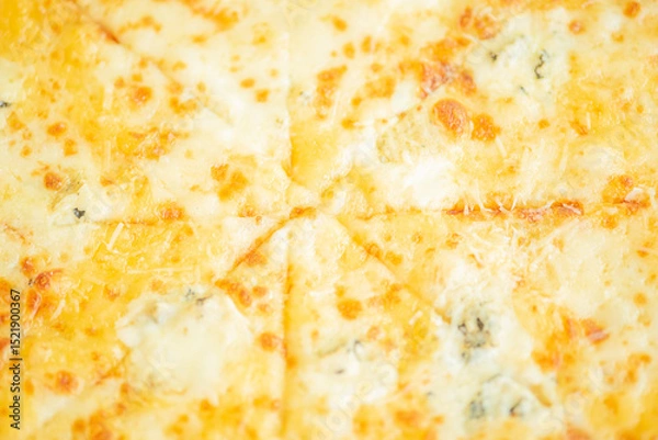 Fototapeta Four cheese pizza as a background macro photo.