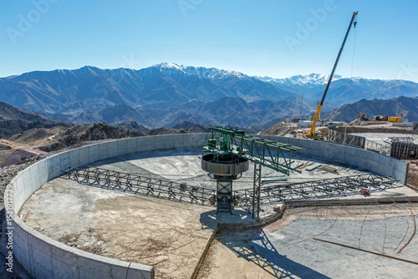 Fototapeta Concrete thickener is installing. Thickening is a process where a slurry or solid-liquid mixture is separated to a dense slurry containing most of the solids and an overflow of essentially clear water
