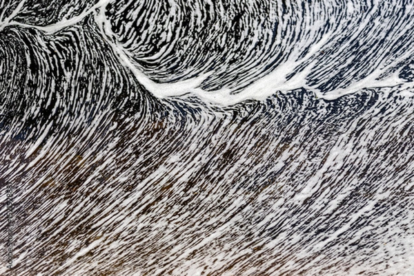 Obraz Froth pattern formed on surface of a running stream