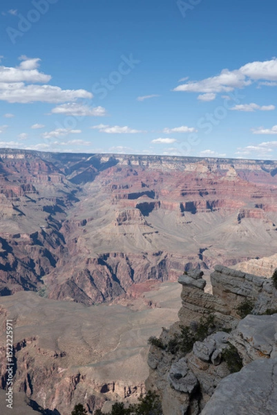 Obraz Panoramic views of the Grand Canyon, Arizona, USA, showcasing the dramatic landscape, layered rock formations, and vivid colors under a clear sky. Perfect for travel and nature themes.
