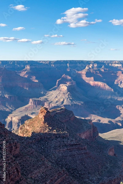 Obraz Panoramic views of the Grand Canyon, Arizona, USA, showcasing the dramatic landscape, layered rock formations, and vivid colors under a clear sky. Perfect for travel and nature themes.