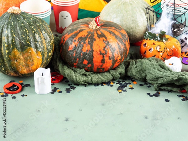 Fototapeta Halloween party setting with pumpkins, candies and decor