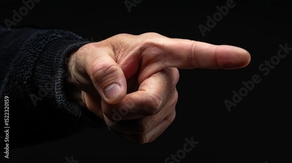 Fototapeta Realistic human hand pointing forward with extended index finger on black background for editing