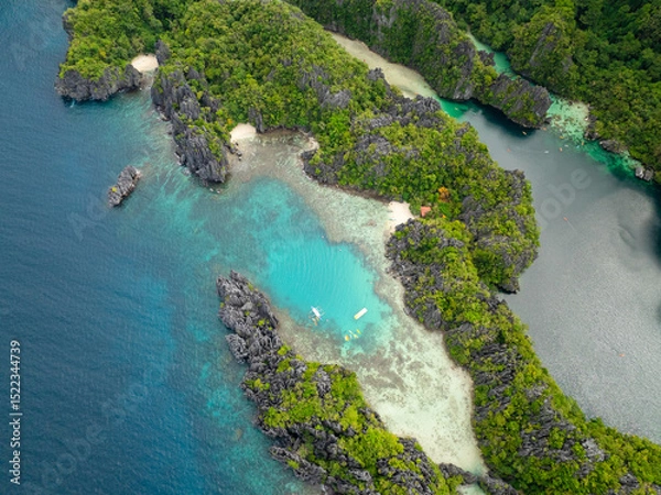 Fototapeta Kayaks over clear turquoise water in Small Lagoon in Miniloc Island. El Nido, Palawan. Philippines.