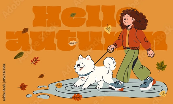 Fototapeta Warm autumn scene with a smiling girl walking her fluffy dog through puddles and fallen leaves