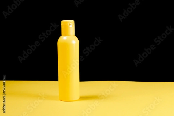 Obraz Yellow bottle in minimalist style