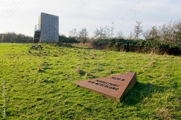 Fototapeta Wekerom Netherlands - 3 December 2023 - Sign marking 3620 meter to the center of the Netherlands in Lunteren