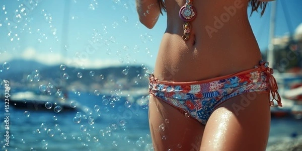 Obraz Summer fun by the beach: girl blowing bubbles in colorful bikini
