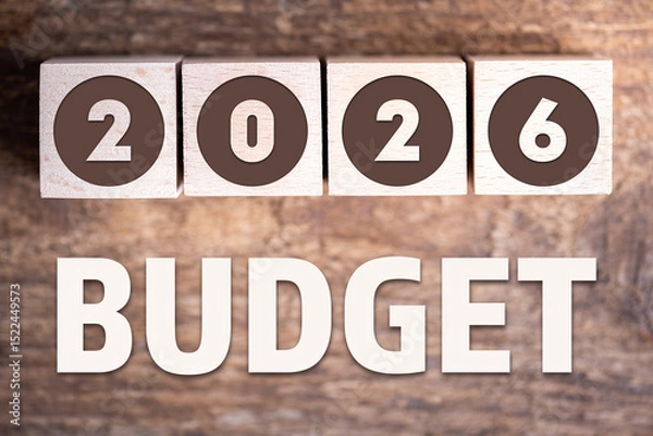 Fototapeta Budget 2026 new year on wooden blocks and office business concept background. 2026 Budget planning and allocation concept concept. 2026 New year resolutions, goals