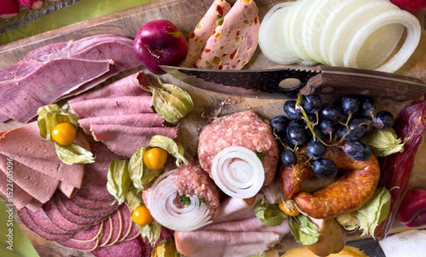 Obraz Sausage platter with different types of sausage on a wooden board