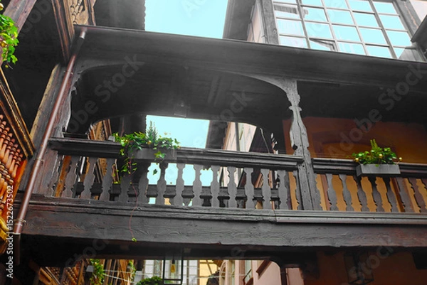 Fototapeta Balcony on inner yard with traditional half-timbered house, Strasbourg, France