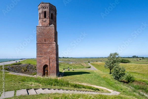 Obraz The Plompe Toren (clumsy tower), located near Burghsluis, Netherlands, is the sole reminder of the flooded village Koudekerke.