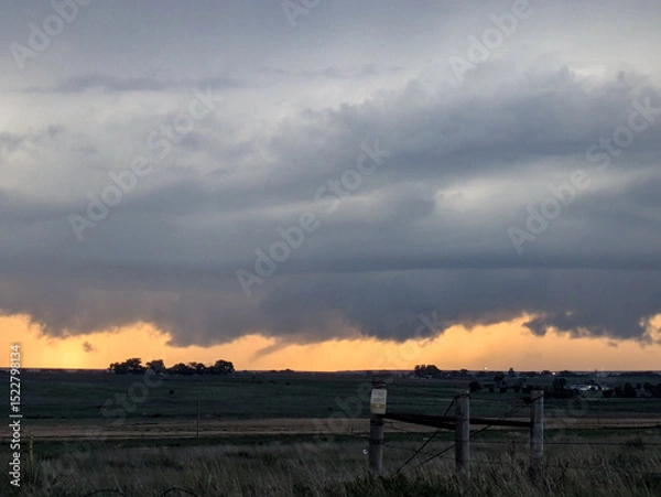 Obraz Funnel cloud over the horizon at sunset