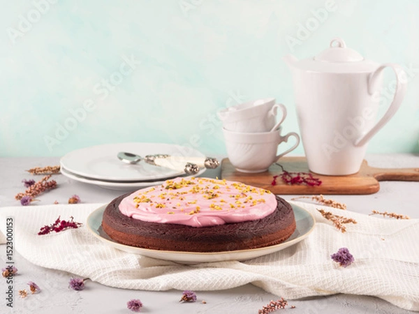 Fototapeta Beetroot chocolate cake with pink cream cheese pistachio icing