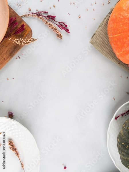 Fototapeta Fall thanksgiving table setting pumpkin decor concept flatlay on gray