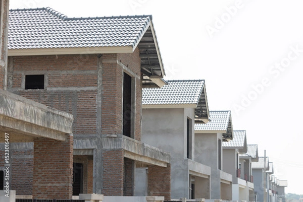 Fototapeta Side view of  construction house with 
tile roof