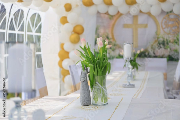 Fototapeta Garden tent for a communion party with a table and white decorations.