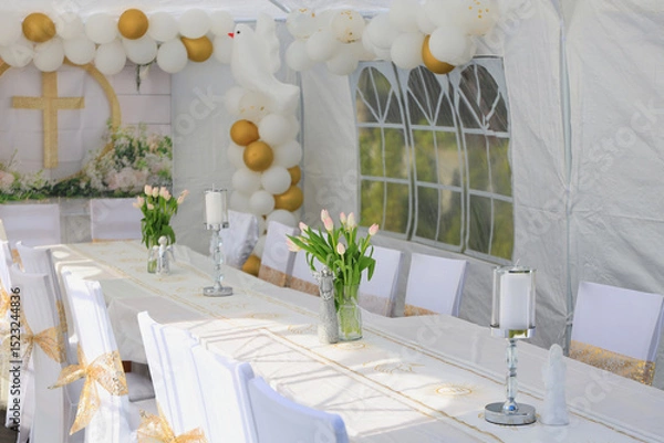 Fototapeta Garden tent for a communion party with a table and white decorations.